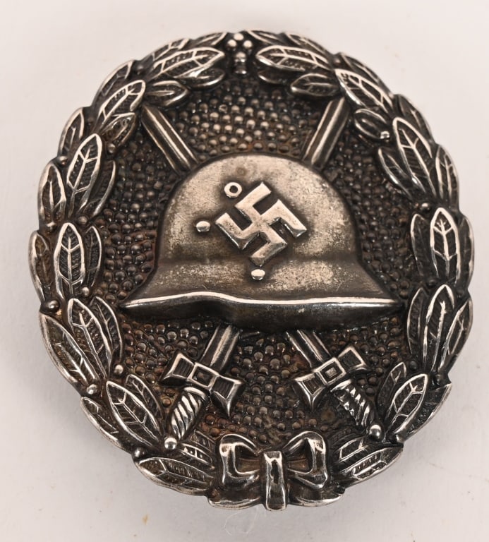 WWII NAZI GERMAN CONDOR LEGION WOUND BADGE WW2: Die struck, first pattern 1936 Wound Badge with coke bottle shaped pin to the reverse. There is some wear to the black paint on the front of the badge. Excellent.