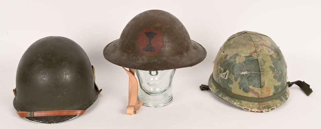 WW1 WWII VIETNAM HELMET WITH LINERS LOT WWI WW2: Lot of US Headgear to include 1) WW1 US BRITISH MADE 7TH DIVISION PAINTED HELMET. The helmet has a modern replaced liner assembly and chinstrap but the exterior is completely original.World War I Comb