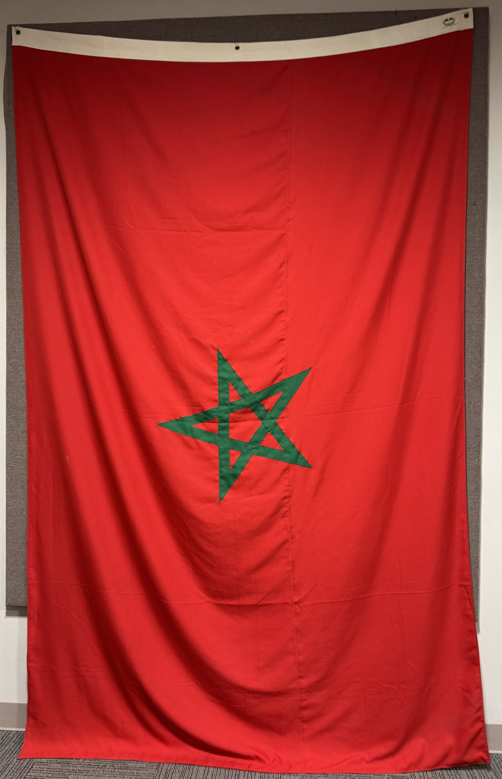 LARGE MOROCCAN FLAG SAUDI MADE: Large high quality Moroccan Flag made by a Saudi Firm measuring 88 X 144 inches and is very well made of polished red cotton with a sewn green pentagram to its center and is double sided. Excellent