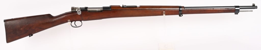 CHILEAN MODEL 1895 LOEWE BERLIN in 7 X 57 MM: SERIAL NUMBER: H2647 BARREL: 29 1/2" CALIBER: 7 X 57 MM. MANUFACTURED: 1895 . Metal is light blue finished with blade front sight and 2000 meter ladder rear sight. Chilean Crest is stamped on top of r