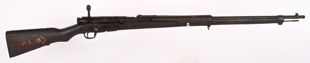 JAPANESE TYPE 38 BOLT ACTION RIFLE 6.5 X 50: SERIAL NUMBER: 23748 BARREL: 31 1/2" CALIBER: 6.5 X 50 MM MANUFACTURED: 1906 - 1945 No import mark. Mum has been defaced. Metal is blue finished with blade type front and 2400 meter ladder style rear 