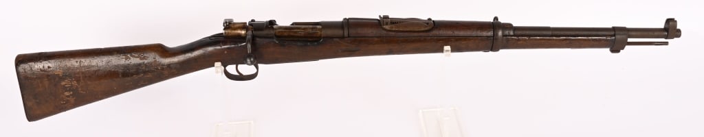 CHILEAN MODEL 1895 MAUSER CARBINE 7 X 57 MM: SERIAL NUMBER: L3055 BARREL: 22" CALIBER: 7 X 57 MM MANUFACTURED: 1899 - 1900 No import mark. Metal is heavy patina with freckling and some surface rust. Bore is dark with rifling showing. Wood shows 