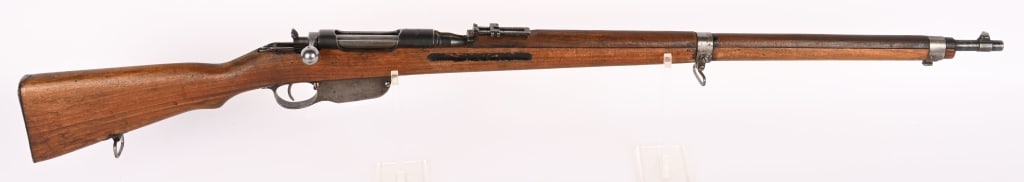 BUDAPEST M95 CUT AWAY TRAINING RIFLE.: SERIAL NUMBER: 48G BARREL: 30" CALIBER: 8X50 MM MANUFACTURED: 1900 - 1918 Metal is blue finish with standard 2600 mm rear and blade front sights. Non matching parts with wood stock. Top of chamber