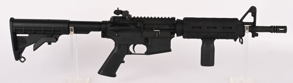 REMINGTON - BUSHMASTER SBR CLASS III IN 5.56 MM: SERIAL NUMBER: ARA020691 BARREL: 12.5" CALIBER: 5.56MM MANUFACTURED: 2000's Metal is standard finish with A2 front sight and flip up rear. M-4 butt stock with MAGPUL forend and pistol grip. A2 pistol 