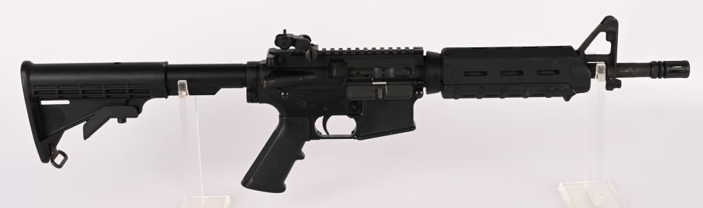 REMINGTON - BUSHMASTER SBR CLASS III IN 5.56 MM: SERIAL NUMBER: ARA017836 BARREL: 12.5" CALIBER: 5.56MM MANUFACTURED: 2000's Metal is standard finish with A2 front sight and flip up rear. M-4 butt stock with mag-pul forend and pistol grip. A2 pistol