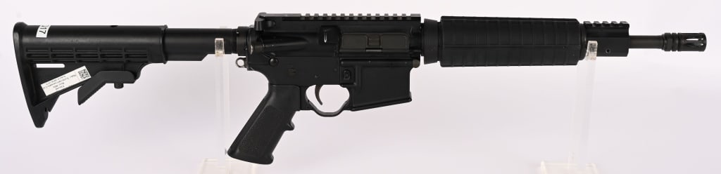 TERRITORIAL GUNSMITHS LTD. SLR15 SBR CLASS III: SERIAL NUMBER: DE811075 BARREL: 12" CALIBER: 5.56 MM. MANUFACTURED: 2000's Metal is standard finish with no sights. Standard M-4 style butt stock, forearm and pistol grip. ( Fargo Police on Butt stock