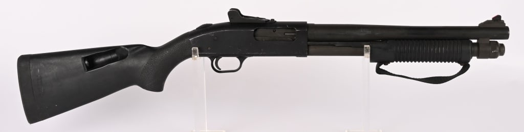MOSSBERG 590 SBS CLASS III PUMP ACTION 12 GA.: SERIAL NUMBER: P218689 BARREL: 14" CALIBER: 12 GA. MANUFACTURED: 2000's Metal is standard mat finished with ghost ring type rifle sights. Black polymer forend and Speed Feed stock. CONDITION: Metal is