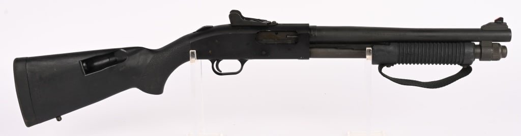 MOSSBERG 590 SBS CLASS III PUMP ACTION 12 GA.: SERIAL NUMBER: P206745 BARREL: 14" CALIBER: 12 GA. MANUFACTURED: 2000's Metal is standard mat finished with ghost ring type rifle sights. Black polymer forend and Speed Feed stock. CONDITION: Metal is