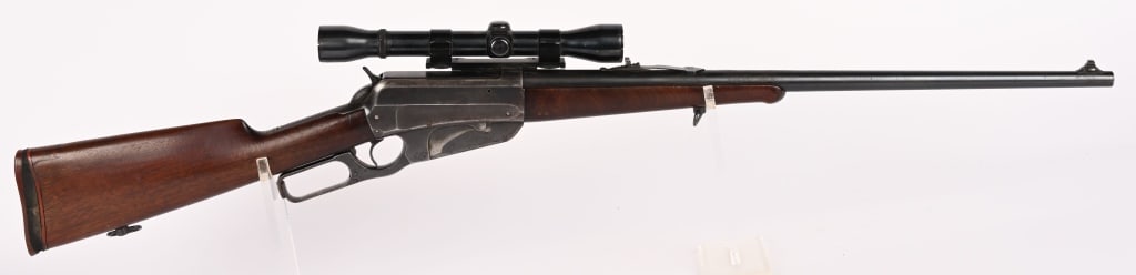 WINCHESTER MODEL 1895 LEVER ACTION RIFLE 35 W.C..: SERIAL NUMBER: 49277. BARREL: 24" . CALIBER: 35 W.C.F. MANUFACTURED: 1905. Metal is blued finished steel with blade front with white bead and flip down rear. Two line Winchester address on left side. 