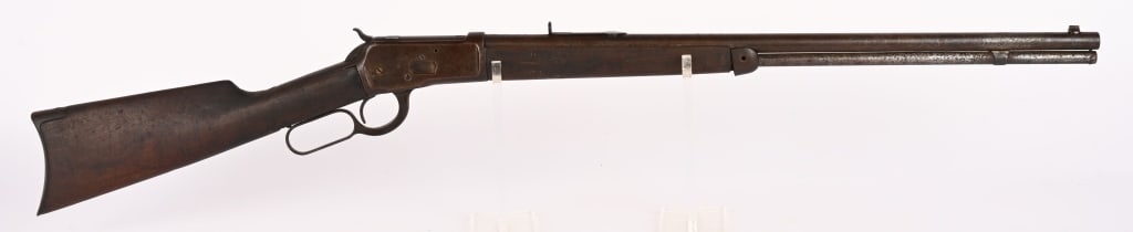 WINCHESTER MODEL 1892 PROJECT RIFLE IN 25-20 WCF: SERIAL NUMBER: 799541 BARREL: 24 1/4" CALIBER: 25 - 20 W.C.F. MANUFACTURED: 1915 This is a great project rifle only missing rear sight elevator and forend cap screw. CONDITION: Metal has a heavy