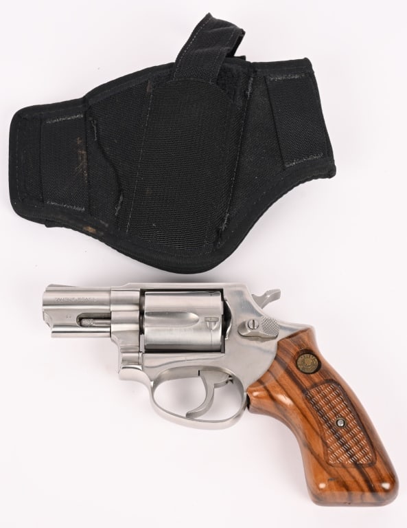 TAURUS MODEL 85 DOUBLE ACTION REVOLVER IN .38SPL: SERIAL NUMBER: LI16980. BARREL: 2 1/8". CALIBER: .38 SPECIAL. The model 86 features a nice stainless steel construction, 5 shot fluted cylinder, wood grips and fixed front and rear sights. It comes