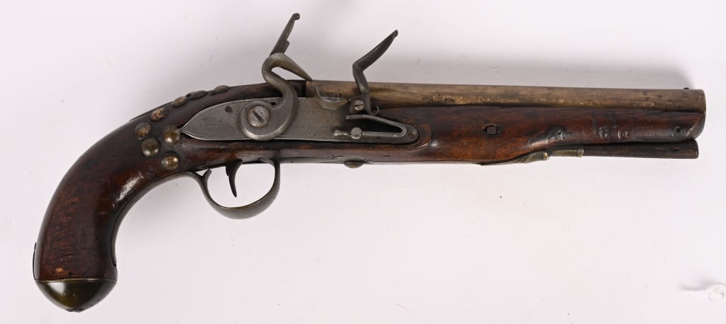 KETLAND BRASS BARREL FLINTLOCK PISTOL: SERIAL NUMBER: N/A. BARREL: 8". CALIBER: about .50. MFG: Late 18th early 19th century. This is a good project gun. The barrel and hardware are brass with a one piece walnut stock. CONDITION: Most of