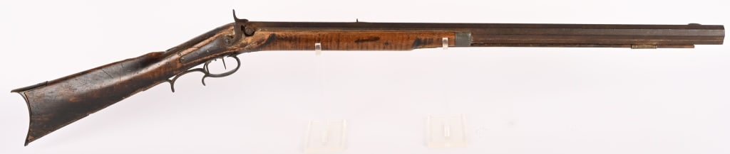 PERCUSSION HALF STOCK RIFLE: SERIAL NUMBER: N/A, BARREL 32 1/2" CALIBER: .about .44 , MFG: Mid 19th century. Heavy full octagon barrel with V notch rear sight and blade front sight. Brass hardware with pewter nose cap. Maple