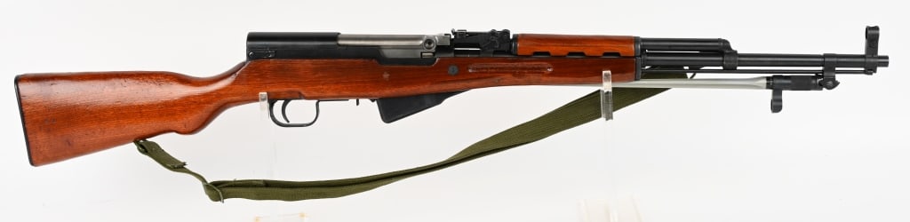 CHINESE NORINCO SKS SEMI AUTO RIFLE 7.62 X 39 MM: SERIAL NUMBER: 20054879. BARREL: 20-1/2". CALIBER: 7.62X39. MANUFACTURED: 1980's-1990's. Import marked on the receiver. Matching serials throughout. Standard iron sights. This gun has a folding spike