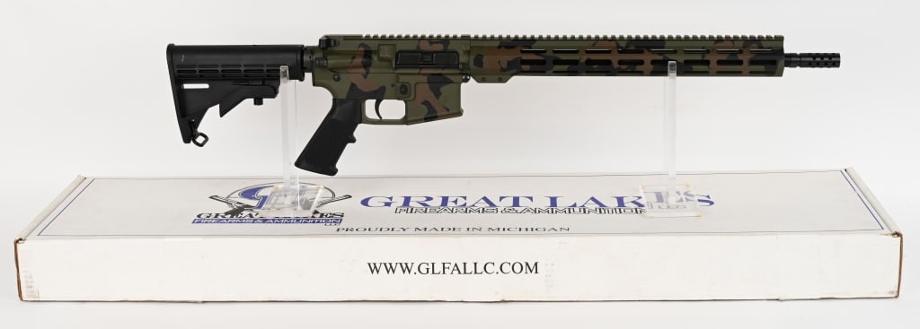 GREAT LAKES FIREARMS NORTH WOODS CAMMO GL-15 RIFLE: SERIAL NUMBER: 15A105288. BARREL: 16". CALIBER: .223. CHAMBER: WYLDE. The rifle features a direct impingement gas system, HBAR barrel profile, an A2 style synthetic pistol grip and an M4 style