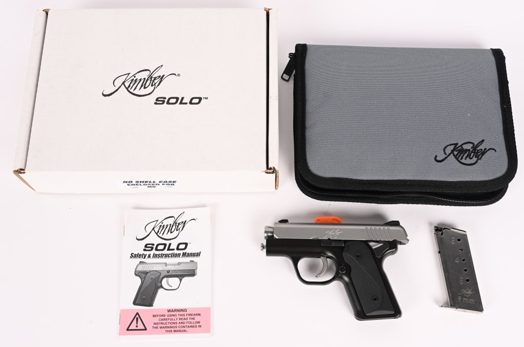 KIMBER SOLO CARRY SEMI AUTO PISTOL W/ BOX: SERIAL NUMBER: S1121732. BARREL: 2 3/4". CALIBER: 9MM. High quality small carry gun with alloy frame and stainless slide with white dot combat sights, black semi checkered grips and (1) 6 round
