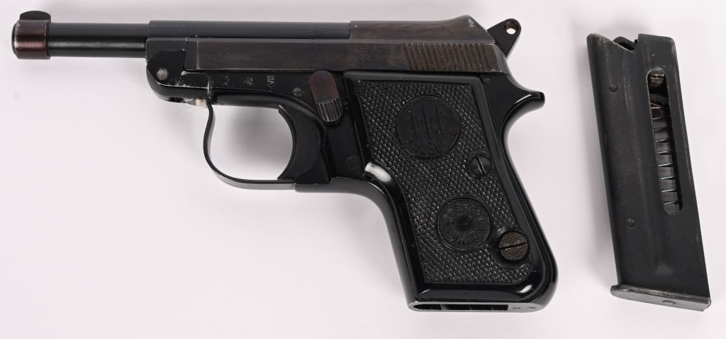 P BERETTA MODEL 950 B SEMI AUTOMATIC PISTOL: SERIAL NUMBER: C56528. BARREL: 3 3/4". CALIBER: .22 SHORT. MANUFACTURED: 1967. Made in Italy. Matching serial numbers throughout. Blade front sight and u-notch rear. Original blued finish and black ch