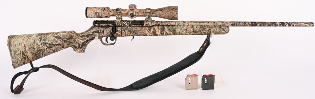 SAVAGE M93 MOSSY OAK CAMO BOLT RIFLE .22WMR: SERIAL NUMBER: 1104012. BARREL: 22". CALIBER: .22WMR. This rifle features a nice Mossy Oak cammo finish on rifle and scope, adjustable AccuTrigger, tapered lightweight barrel and sports a Simmons