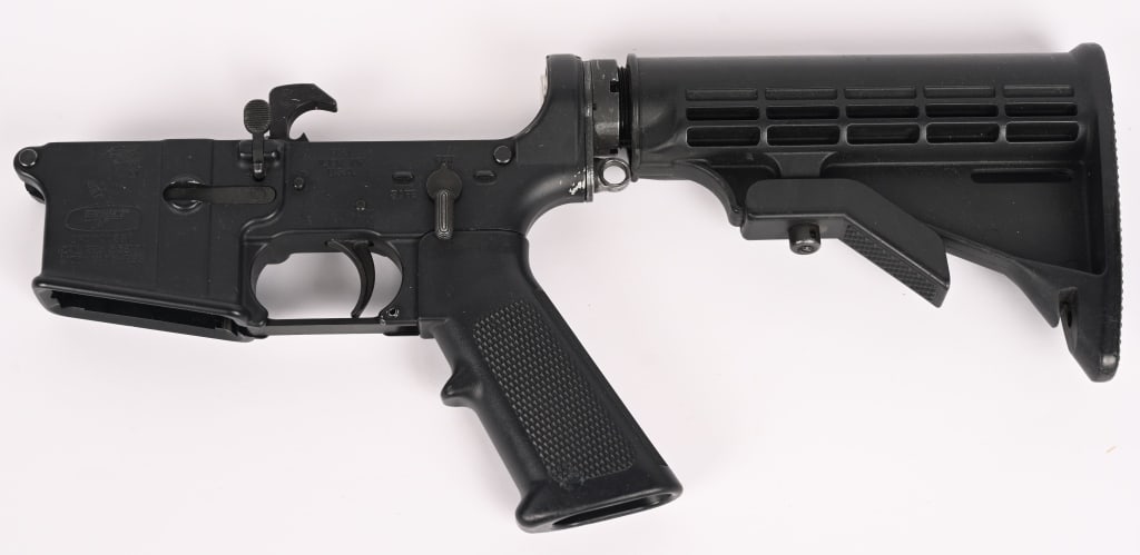 BUSHMASTER XM-15 COMPLETE LOWER AR15: SERIAL NUMBER: ARA020668. CALIBER: 223 5.56MM. Bushmaster XM-15 E2S complete lower receiver assembly. It has all the appropriate AR15 features that you would expect, except the addition of a QD sling