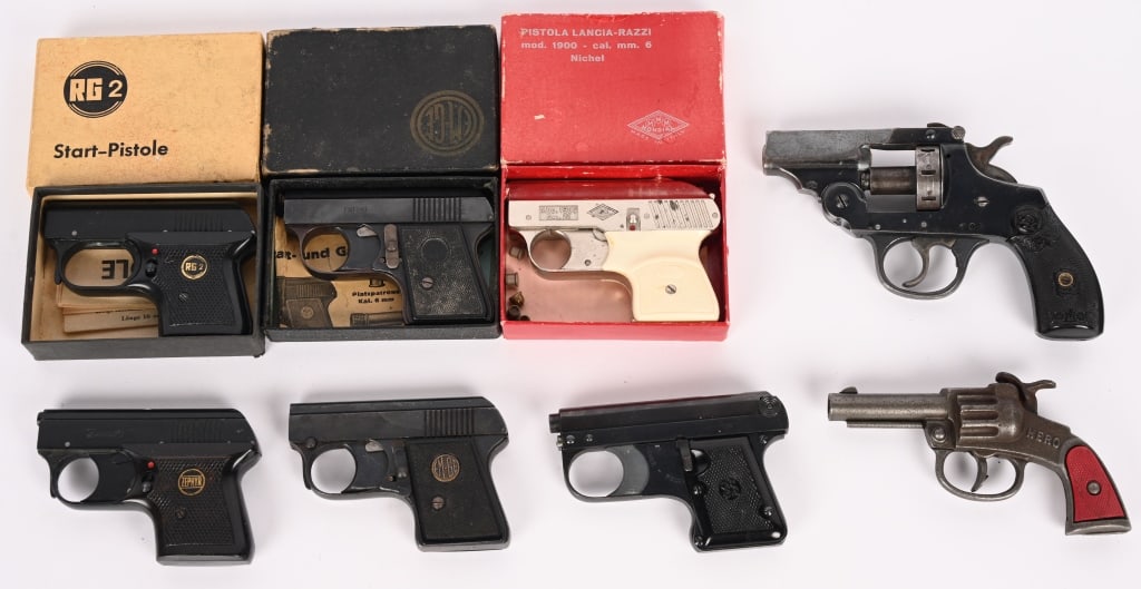 8 PC LOT OF STARTER PISTOLS & VINTAGE CAP GUN: This lot contains a great little Hero cap gun in great shape. It also contains 7 starter pistols from manufacturers such as Iver Johnson, EMGE, Zephyr, Lancia-Razzi and RG.