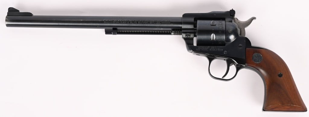 RUGER NEW MODEL SINGLE SIX REVOLVER .22WMR: SERIAL NUMBER: 66-72727. BARREL'; 9 1/2". CALIBER: .22 WMR. MANUFACTURED: 1979. Standard six shot single action with blue finish, target adjustable rear sight, high blade front sight and walnut two pi