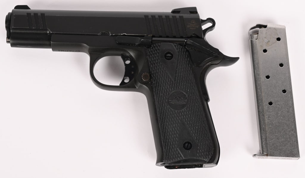 ROCK ISLAND ARMORY MODEL 1911A .380 PISTOL: SERIAL NUMBER: RIA2091664. BARREL: 3-3/4". CALIBER: .380 ACP. MANUFACTURED: 2019. Made in the Philippines. Factory blade front sight and u-notch rear. Matte blued finish and checkered rubber grips.