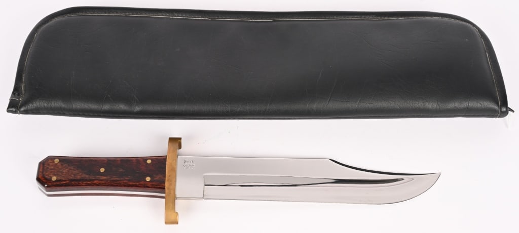 BUCK CUSTOM 10 INCH BOWIE KNIFE: (1) BUCK CUSTOM BOWIE KNIFE. BLADE: 10". OAL: 15 3/16". BLADE STOCK: 0.181". BLADE DEPTH: 1.92". This coffin handle Bowie features rich deep wood scales with brass rivets, high polished blade with ful