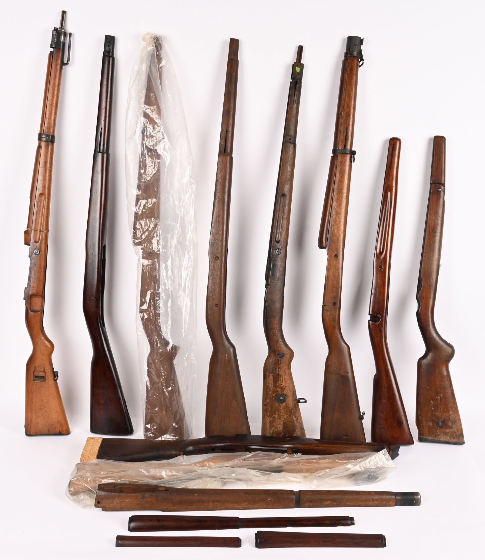 LOT OF 11 MILITARY & SPORTING RIFLE STOCKS: lot of 11 military and sporter type rifle stocks with some handguards. CONDITION: Some like new, some used.