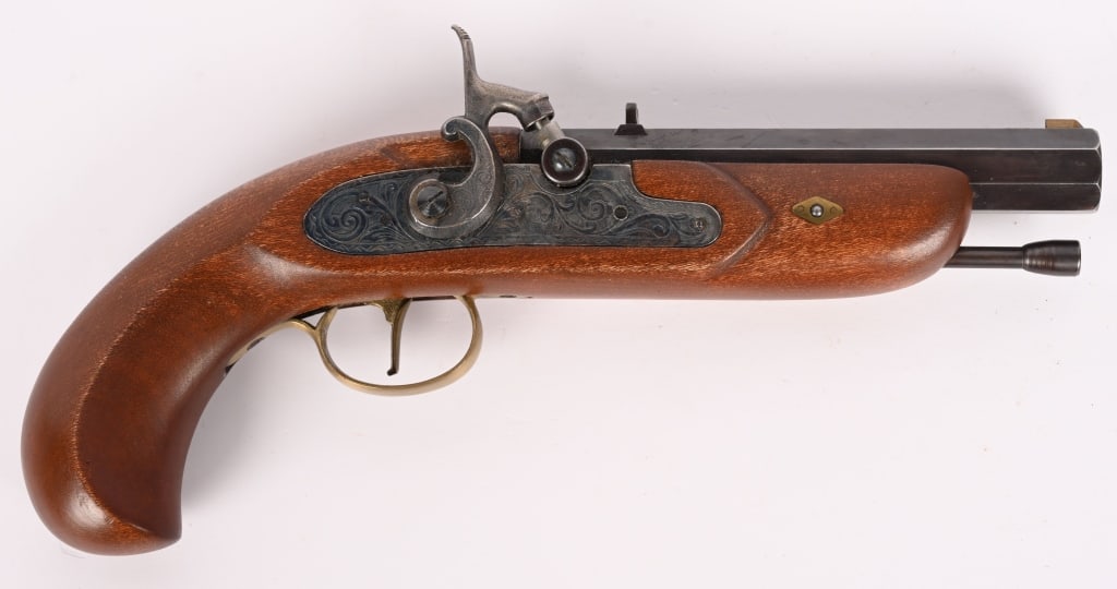 DIKAR SPAIN .45 CAL BLACK POWDER PISTOL: SERIAL NUMBER: 204330. BARREL: 5 1/2". CALIBER: .45. This percussion pistol features a blued octagonal barrel, wood pistol stock, nicely engraved lock plate, brass trigger guard and ram rod.
