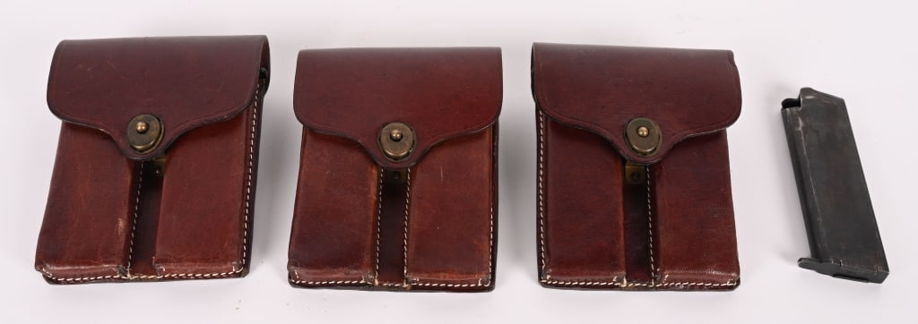 7 STAR BONIFACIO MAGAZINES IN LEATHER BELT POUCHES (1 of 2)