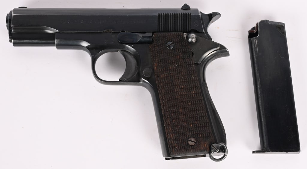 GABILONDO Y CIA -ELGOIBAR LLAMA MODEL 1 IN 7.65MM: SERIAL NUMBER: 63697. BARREL: 3 3/4". CALIBER: 7.65X17 BROWNING / .32 ACP. MANUFACTURED: 1950s. Based on scaled down 1911, blue finish, checkered wood grip panels, lanyard ring and (1) magazine. CONDI