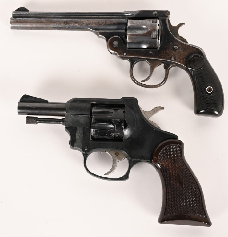 LOT OF 2 REVOLVERS H&R AND FIREARMS INT. CORP.: SERIAL NUMBER: 106669 BARREL: 6" CALIBER: 32 S&W MANUFACTURED: 1900 - 1910 Made in the USA. Blue steel finish with blade front and V notch rear sights. Checkered hard rubber grips with target logo at
