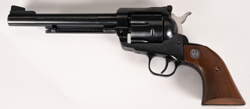 RUGER NEW MODEL BLACKHAWK REVOLVER .357 CALIBER: SERIAL NUMBER: 36-75893. BARREL: 7 1/2". CALIBER: .357 MAGNUM. MANUFACTURED: 1968. This revolve features a bright blued finish, smooth hardwood grips with Ruger eagle medallions, six shot fluted cylin