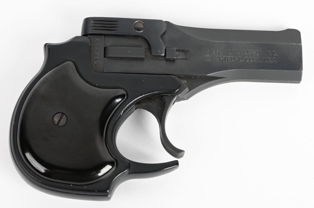 HIGH STANDARD DERRINGER: SERIAL 078348. BARREL 3.5". CALIBER .22 LONG RIFLE . High quality over under .22 derringer with blue finish, cut out trigger guard, black plastic grips. Near mint. Modern