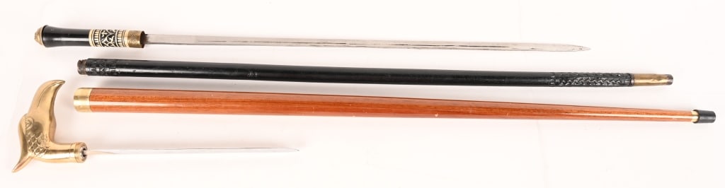 A WALKING STICK AND CANE / KNIFE LOT: (1) This Eagle Head Walking Cane Knife is a unisex cane that has an embossed, solid brass eagle-head handle. The Eagle Head Walking Cane has black shaft that has an overall length of 35 1/2" and a