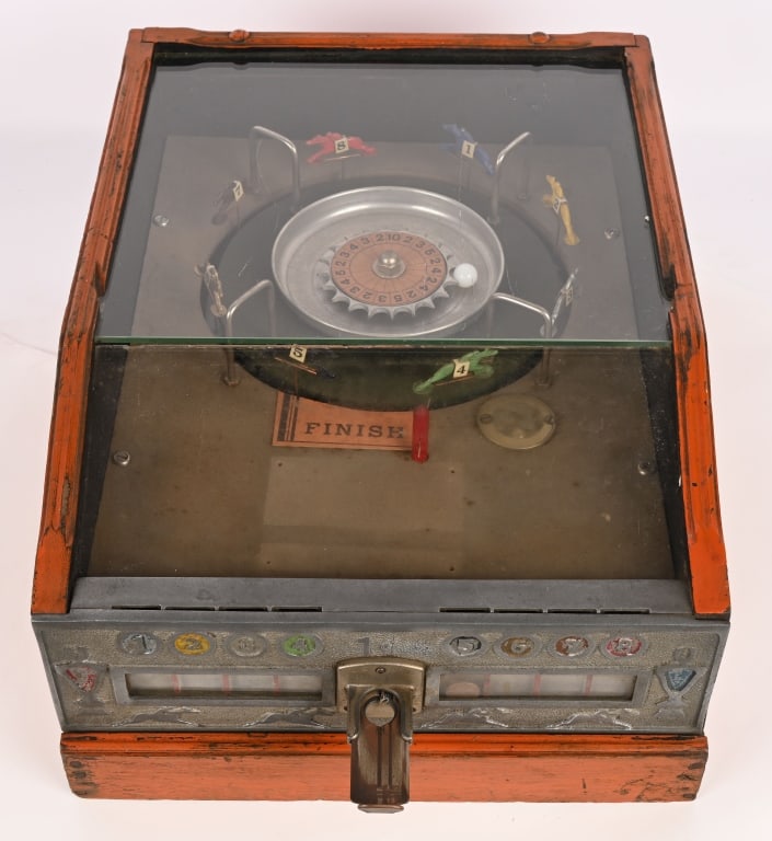 1c AD-LEE NOVELTY KING'S HORSE ROULETTE RACE GAME: Nice looking 1c coin-op countertop roulette style horse race game. Drop a coin in any of the 8 slots to place your bet. All original in very nice condition. Made by Ad-Lee Novelty 1931-1939. Comes