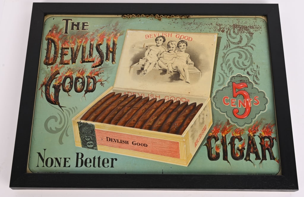 DEVILISH GOOD 5c CIGARS EMBOSSED TIN SIGN: SST Devilish Good 5c Cigars embossed tin Sign. All original with great colors and graphics. Some minor rubbing. Still has hanging chain. Set in wood frame. 15"x11" Excellent