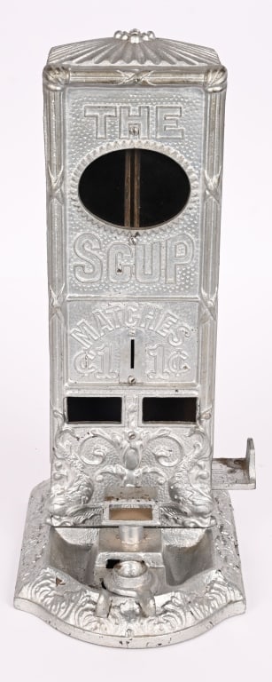 THE SCUP CAST IRON MATCH VENDING MACHINE: Very nice cast iron The Scup Match Vending machine. Very ornate. No breaks or issues. Has been repainted. 13 1/2" Excellent Provenance: Rick Frink Collection