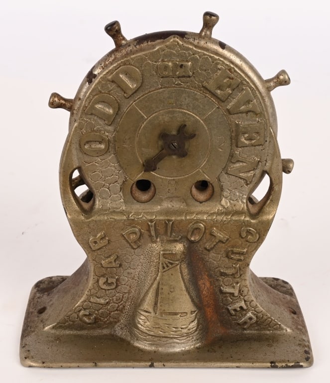 PILOT ODD or EVEN CAST IRON CIGAR CUTTER: Great looking cast iron Pilot Odd or Even Cigar Cutter. Spin wheel and see if arrow lands on Odd or Even. All original in great condition. 7" Excellent Provenance: Rick Frink Collection