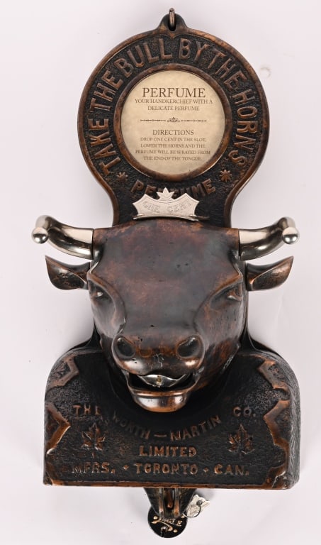 WORTH MARTIN 1c BULL HEAD PERFUME DISPENSER: Worth Martin 1c cast iron Bull Head Perfume Dispenser. Wonderful rare piece. Has nice copper clad finish. Still has wall mounting plate. One cent slot on head possibly replaced. A beautiful piece.