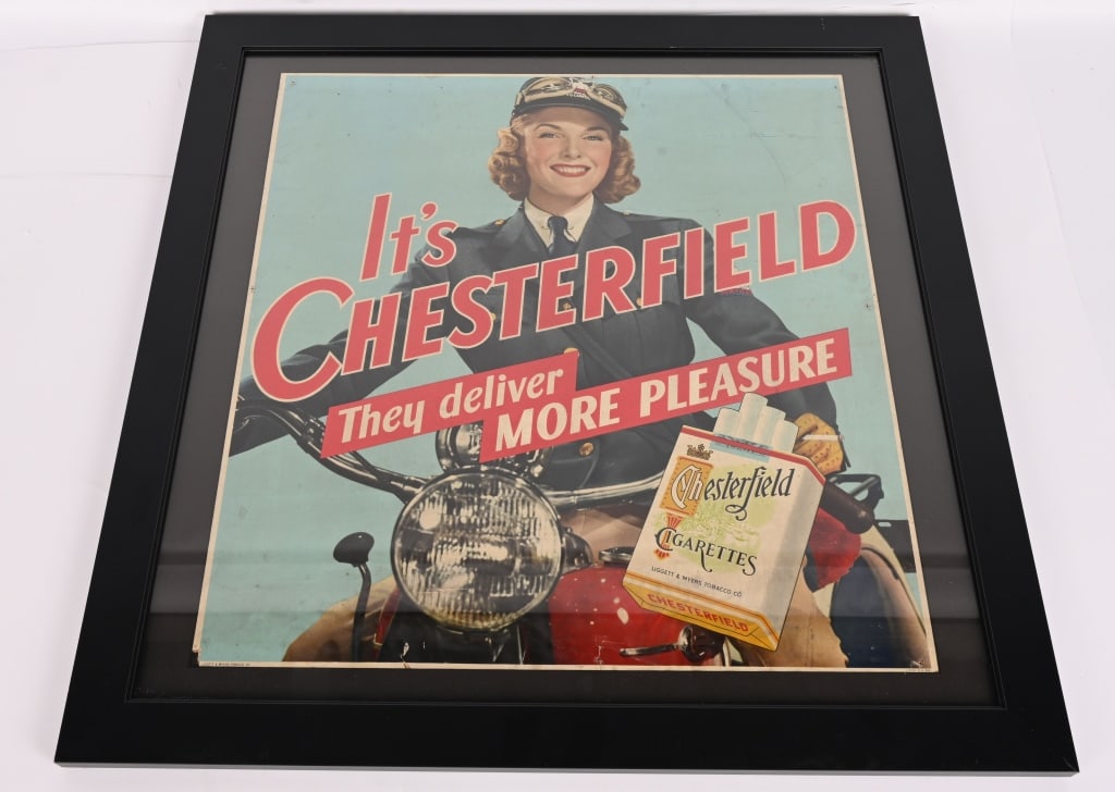 CHESTERFIELD CIGARETTES GIRL ON MOTORCYCLE SIGN: Great looking Chesterfield Girl on Motorcycle cardboard Sign. Great colors and image. Has some creasing on bottom. Displays great. Framed. 27"x27" very Good-Excellent