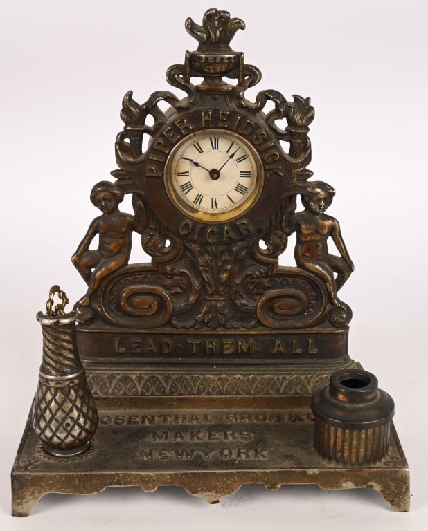 PIPER HEIDSICK CIGAR ADVERTISING LIGHTER w/ CLOCK: Very nice cast iron Piper Heidsick Cigar Advertising Lighter with Clock. All original with great castings. Marked Rosenthal Bros Co Makers New York on base. Rare and wonderful piece. 13"x11" Excellent