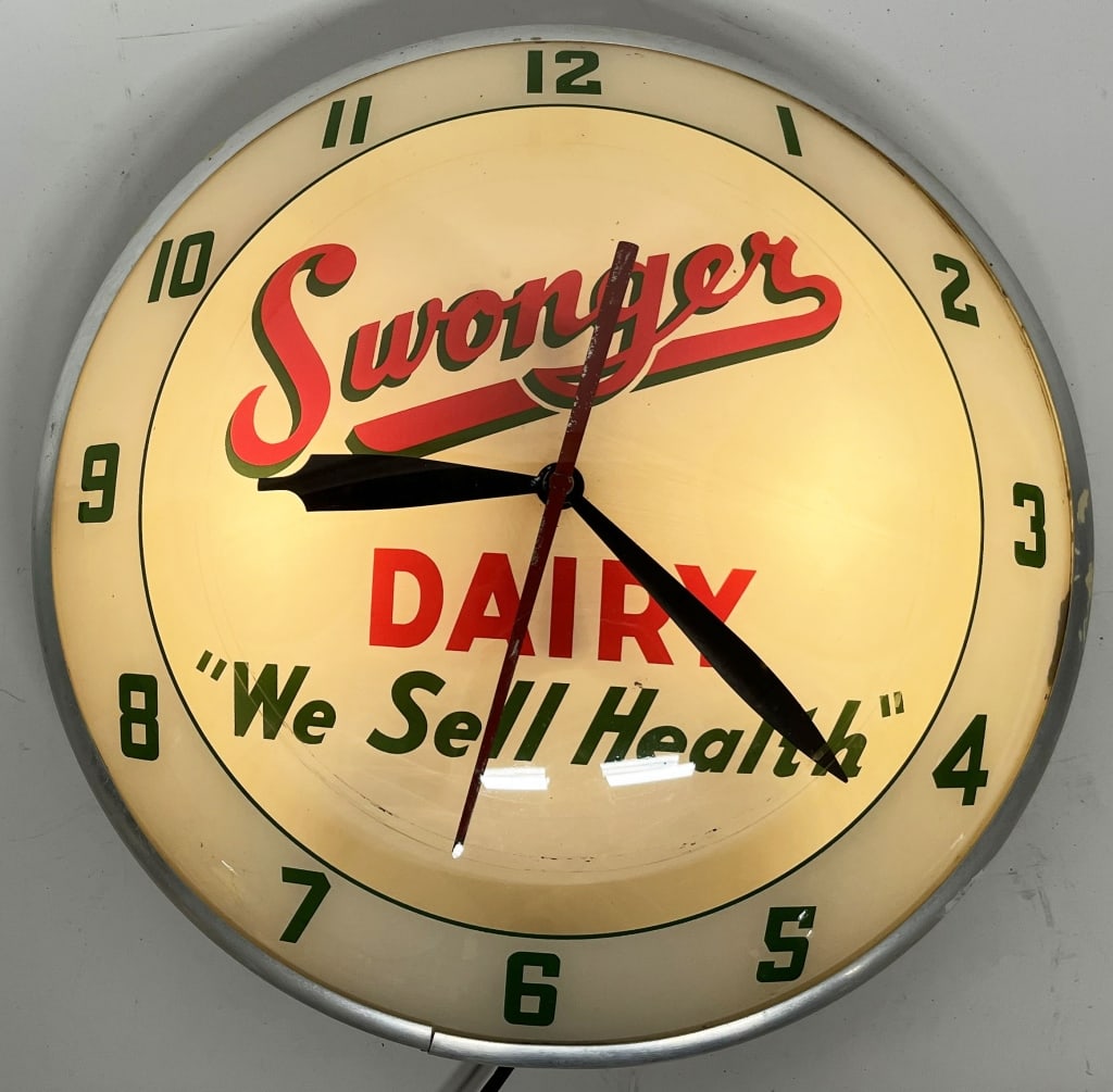 SWONGER DAIRY DOUBLE BUBBLE CLOCK: Wonderful original Swonger Dairy Double Bubble Clock. All original in great condition. Has label on back for AP Advertising Products. Worked when tested. 15" Excellent