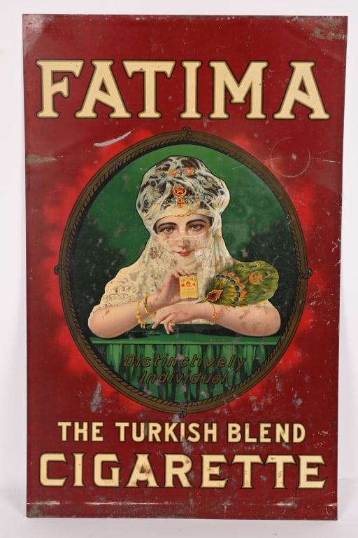 FATIMA CIGARETTES TIN SIGN: SST Fatima Cigarettes tin Sign. Wonderful color image of woman. Sign has some spots of loss. 28 1/2"x18" Very Good