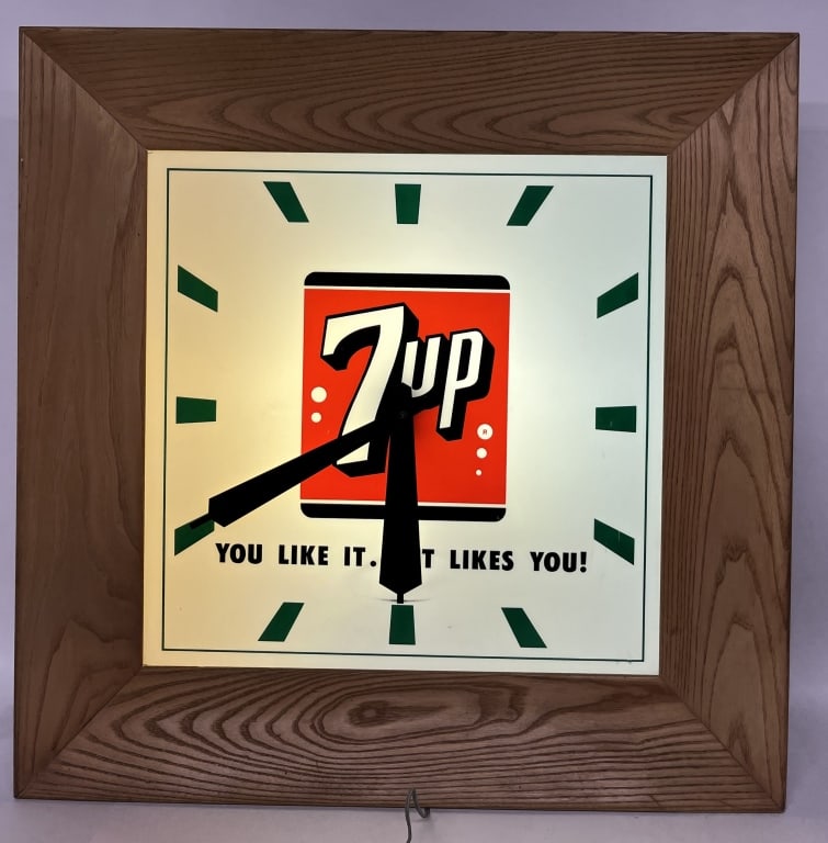 7-UP LIGHTUP ADVERTISING CLOCK: Nice 7-Up Advertising Clock. Plastic electric clock set in wood frame. Worked when tested. Nice condition. 34 1/2" Excellent