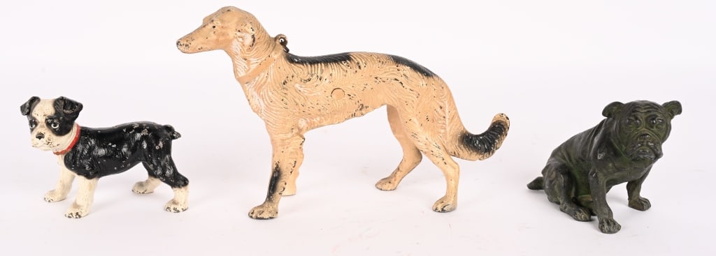 3- CAST IRON DOG DOOR STOPS: Lot of cast iron Dog Door Stops. Includes Whippet, Bulldog, and Boxer. All in great shape. largest 12" Excellent
