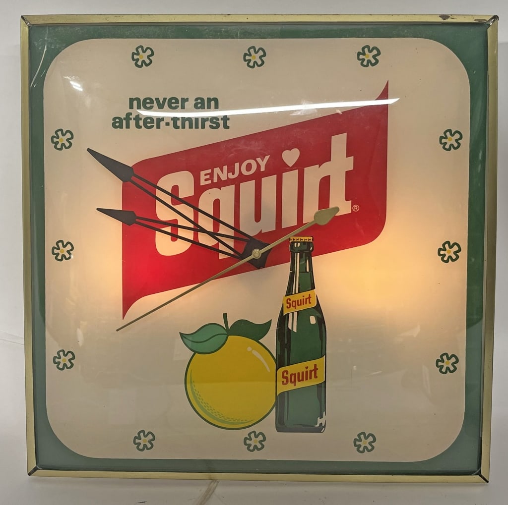 ENJOY SQUIRT PAM CLOCK: Enjoy Squirt PAM Clock. All original with nice colors. Bubble has small crack on top corner. Displays great. Worked when tested. Has PAM decal on back. 15" Excellent