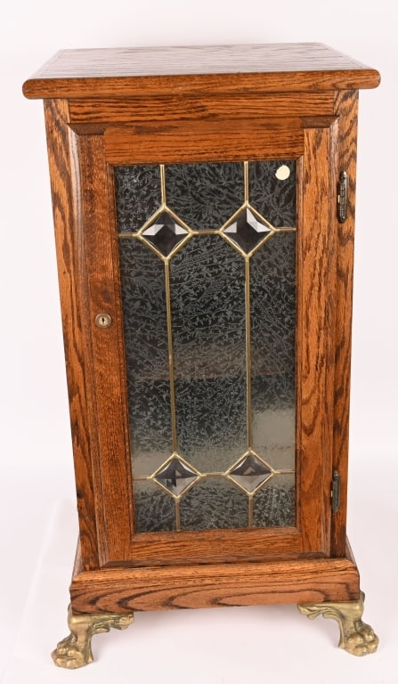 SLOT MACHINE STAND w/ LEADED GLASS DOOR: Contemporary wooden Slot Machine Stand with leaded glass door. Very nice condition with claw feet. 34"x17"x17" Excellent This is not a standard shippable item and will require 3rd party shipping or pi