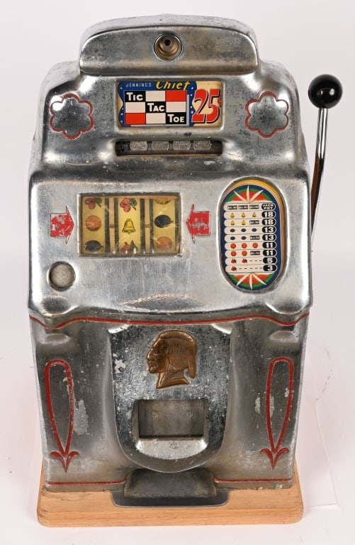 JENNINGS 25c TIC TAC TOE CHIEF SLOT MACHINE: Jennings 25c Tic Tac Toe Slot Machine. All original and working when tested. Has loss to finish. Comes with keys. 26" Very Good This is not a standard shippable item and will require 3rd party