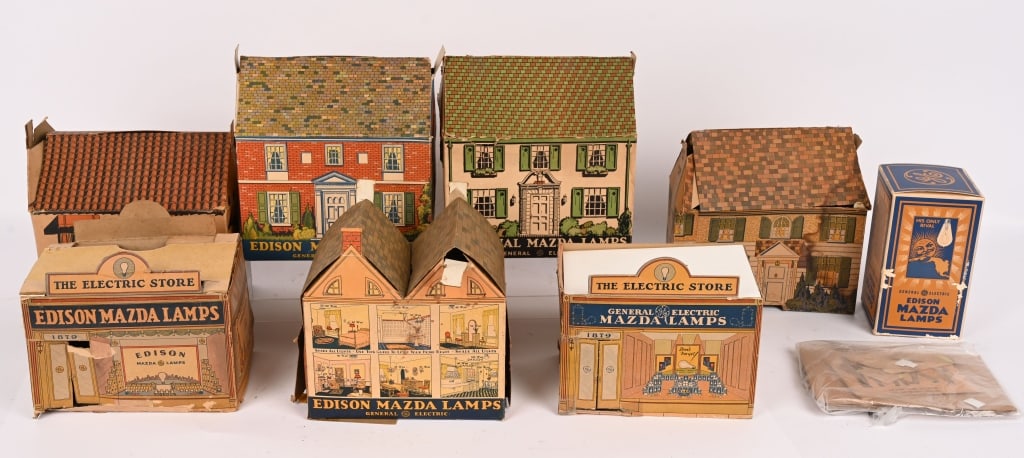 7- EDISON MAZDA LAMPS VILLAGE BUILDING BOXES: Nice lot of early Edison Mazda cardboard buildings. It appears these were advertising premiums made for children. An article is included with the lot. The condition varies and all have wear. A great